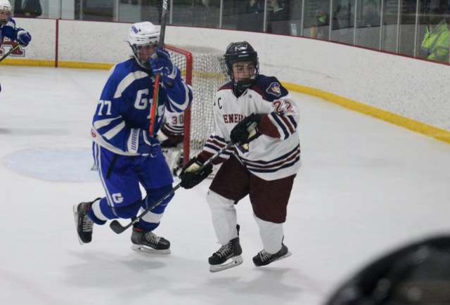 At+the+drop+of+a+puck--+Senior+captain+Brendan+Occhino+races+against+his+defender+for+a+loose+puck+in+the+General%E2%80%99s+most+recent+bout.+Occhino+is+a+tri-sport+athlete+who+is+a+star+on+the+court+and+off+of+it.+