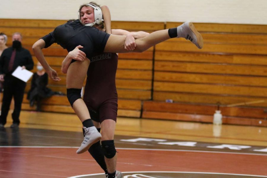 Pins and points -- Senior Jason Guglietta faces an opponent on the wrestling mat. The team returned to action after last year’s season was canceled due to the pandemic.  
