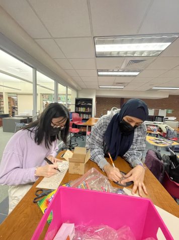 Collaboration in celebration-- Co-President of Muslim Student Union, Imaan Alrahani (right) and Social Justice Council member Lorraina Chen (left) help Black Student Union create educational posters for Black History Month. Black History Month takes place during the month of February, with many opportunities to participate available.