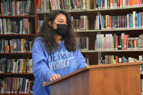 Poet and I know it-- Senior Kasay Chandlar performs her poem from the senior Poetry class. English teacher Virginia Gillis took her Poetry class to the library to perform their writing in front of the class.