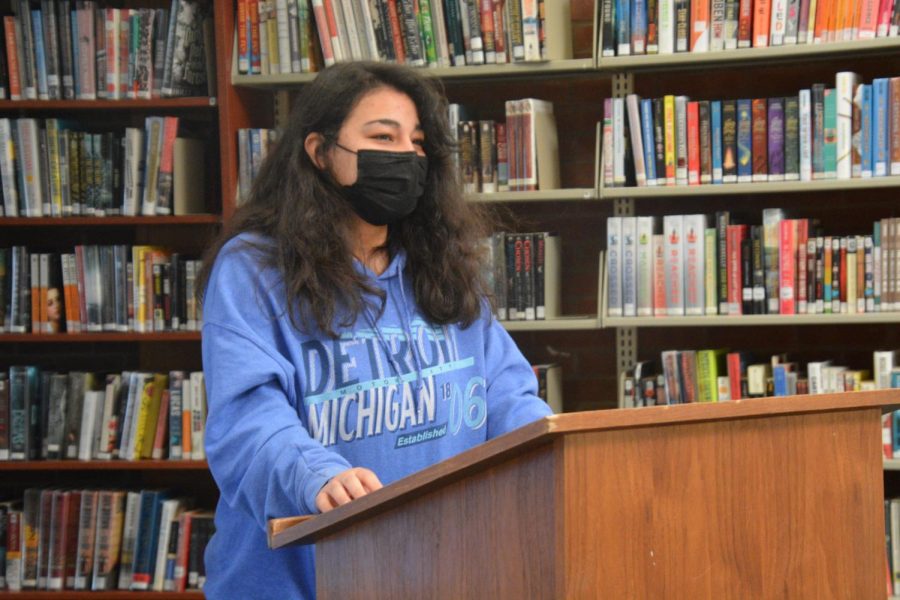 Poet+and+I+know+it--+Senior+Kasay+Chandlar+performs+her+poem+from+the+senior+Poetry+class.+English+teacher+Virginia+Gillis+took+her+Poetry+class+to+the+library+to+perform+their+writing+in+front+of+the+class.