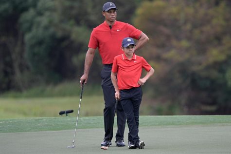  Like father like son - Tiger and Charlie Woods, looking to keep their solid round going, in order to have a chance at winning the PNC Championship. T. Woods was recently in a car accident. 
