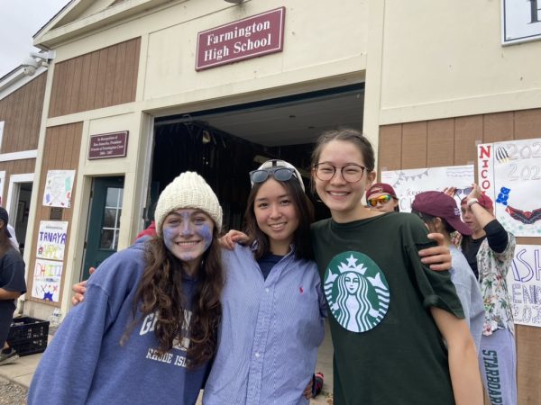 Say Cheese-- Ruby Wisniewski (left), Sara Devlin (center), and Vivien Hua (right) in costume. Boats dressed up in team costumes for the annual Pumpkinhead Regatta that took place on November 4, 2023. 