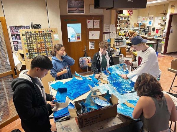  Connecting Classwork to the Community-- Aspire Art Installation Students work on their art installation project. This year’s oceanic theme was chosen to bring awareness to the recent Maui fires and will go on display at the Farmington Public Library in January.