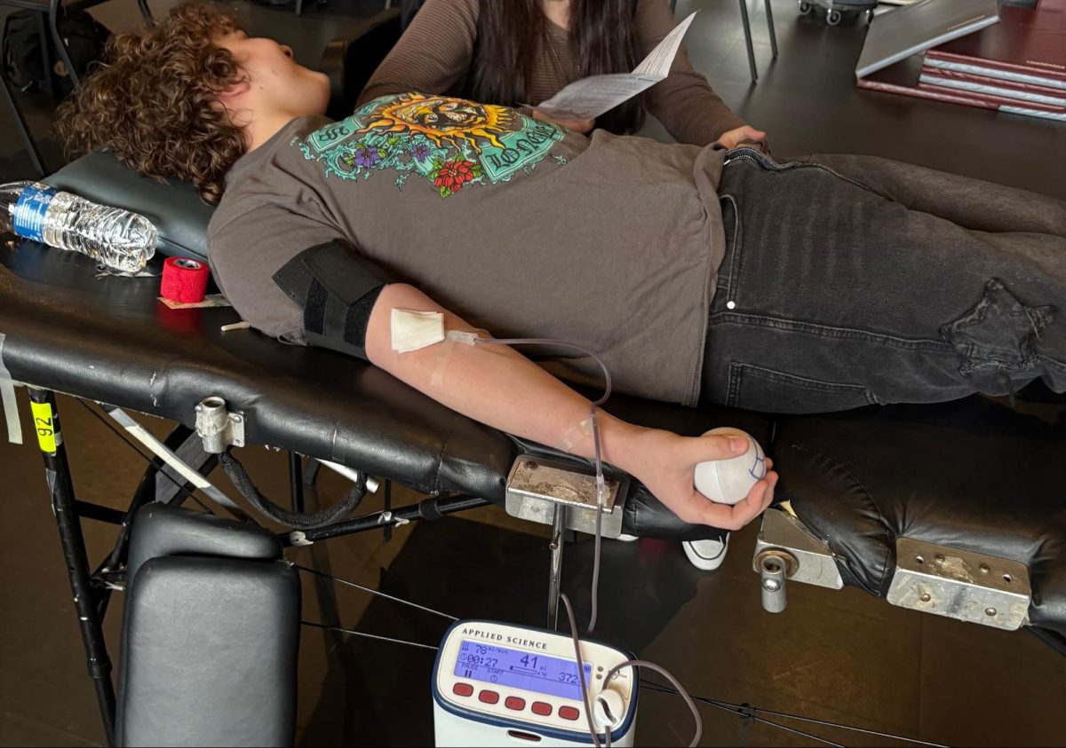 Every drop counts!--(Pictured) Senior Gage Barrow-Kulesza donating blood. On March 31, 2025 the American Red Cross Club and National Honor Society came together to sponsor a blood drive to help those in need.