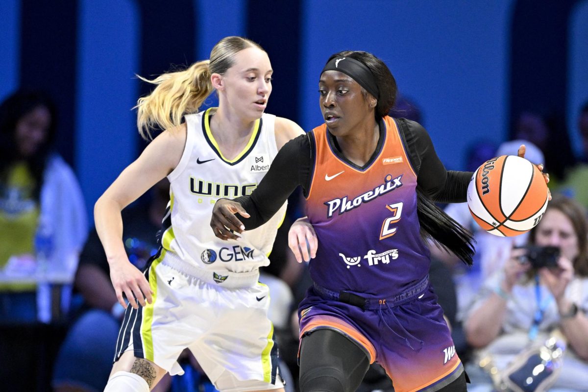 Sep 11, 2025; Arlington, Texas, USA; Phoenix Mercury guard Kahleah Copper (2) looks to move the ball past Dallas Wings guard Paige Bueckers (5) during the first half at College Park Center. Mandatory Credit: Jerome Miron-Imagn Images