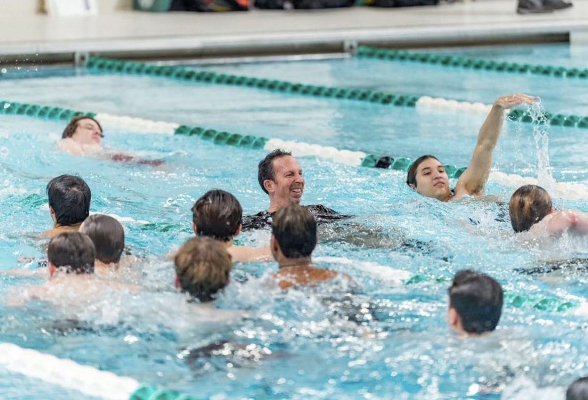 Diving in! -- Coach Ferrigno and members of the FHS Boy’s Swim and Dive team celebrating their CCC West Championship title! The boys secured their title in their meet against Southington on February 9, 2026. 
